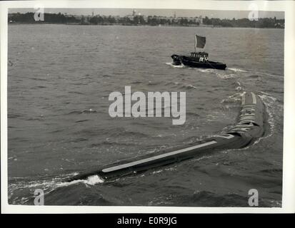 Sep. 09, 1958 - Demonstration of the Flexible Barge: Demonstrations were held by today at Southampton of the revolutionary flexible barge, made of nylon and synthetic rubber, containing a cargo of kerosene. The flexible barge, called ''Dracone'', can be towed by any vessel of reasonable power, and has been developed for the transport of liquids lighter than water. When emptied the barge can be wound up on a spool. Photo shows The Dracone flexible barge, showing its manoeuvrability - during today's demonstration at Southampton. Stock Photo