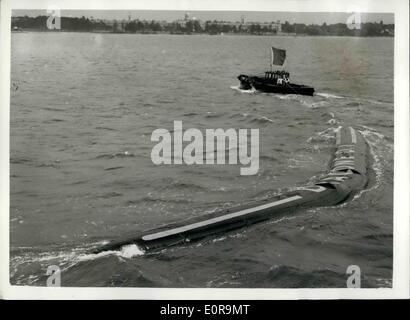 Sep. 09, 1958 - Demonstration Of The Flexible Barge: Demonstrations were held today at Southampton of the revolutionary flexible barge, made of nylon and synthetic rubber, containing a cargo of kerosene. The flexible barge, called '' Dracone'', can be towed by any vessel of reasonable power, and has been developed for the transport of liquids lighter than water. When emptied the barge can be wound up on a spool. Photo Shows: The Dracone flexible barge, showing its manoeuvrability - during today's demonstration at Southampton. Stock Photo