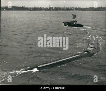 Sep. 09, 1958 - Demonstration Of the Flexible Barge: Demonstrations were held today at Southampton of the revolutionary flexible barge, made of nylon and synthetic rubber, called ''Dracone'', can be towed by any vessel of reasonable power, and has been developed for the transport of liquids lighter than water. When empted the barge can be wound up on a spool. Photo shows. The Darcone flexible barge, showing its manoeuvrability-during today's demonstration at Southampton. Stock Photo