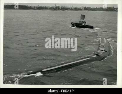 Sep. 09, 1958 - Demonstration Of The Flexible Barge.: Demonstrations were held today at Southampton of the revolutionary flexible barge, made of nylon and synthetic rubber, containing a cargo of kerosene. The flexible barge, called ''Dracone''. can be towed by any vessel of reasonable power, and has been developed for the transport of liquids lighter than water. When emptied the barge can be wound up on a spool. Photo shows The Dracone flexible barge, showing its manoeuvrability - during today's demonstration at Southampton. Stock Photo