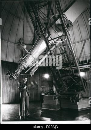 Nov. 11, 1958 - The New Royal Greenwich Observatory - Herstmonceux Castle - Sussex. Giant telescope which were mounted at Greenwich have been re-erected at ''Dome Town'' Herstmonceux Castle, Sussex.. The move has been going on for years - and is now complete.. The famous castle is used for administrative offices - labs - and library.. The telescope are housed in the specially constructed domes built in the castle grounds. Keystone Photo Shows:- Dr. Richard van der Riet Woolley the Astronomer Royal - stands beside one of the giant 28'' equatorial telescopes at the new Greenwich Observatory. Stock Photo