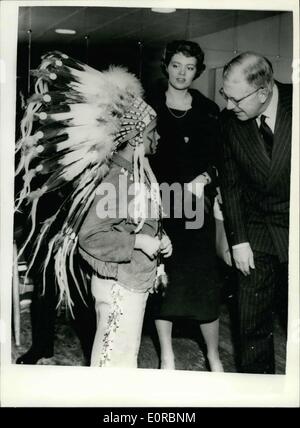 Dec. 23, 1958 - King Gustaf Adolf - and his Grandson- the white eagle'' at school show.: To Mark the end of the term and start of the Christmas holidays - the pupils of the school attended by Prince Carl Gustav of Sweden presented a real Wild West Show. The Prince himself took on the role of ''The White Eagle'' Photo shows ''The White Eagle'' Prince Carl Gustaff chatting with his grandfather - King Gustaf Adolf, Between them is his sister Prince Birgitta. Stock Photo