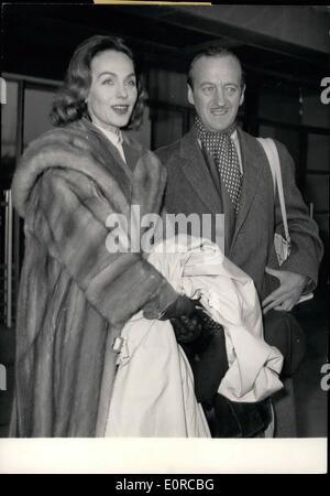 Jan. 01, 1959 - British actor David Niven and his wife in Paris : David Niven who won the prize of the best masculine interpretation for has part in the film ''Tables separates'' in new-york recently arrived in Paris this morning with his wife. photo shows David Niven and his wife photographed on their arrival. Stock Photo
