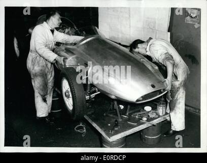 Mar. 03, 1959 - New British Racing Car Being Assembled: A new British Grand Prix racing car - which may replace the Vanwalls - is now being assemble. The new car - a joint effort by industrialist Mr. A.G.B.Owen and Mr. Rob Walker, the motor racing patron - is a Cooper chassis fitted with a 250 b.h.p. 21/2-litre B.R.M. engine, and is to be driven by Stirling Moss. Photo shows The cowling of the new car being fitted today, during assembly at Mr. Rob Walker's racing garage at Dorking. Stock Photo