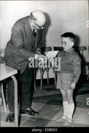 Apr. 04, 1959 - Six-Year Old Saves Brother From Drowning-He Is Rewarded: Six-year-old Jean-Pierre Durand from Perigueux (Central France) saved his little brother from drowning some time ago. Today he was awarded a prize by the National Centre of Prevention and Protection from accidents. Photo shows the little boy being congratulated by the mayor of his community. Stock Photo