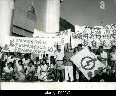 Jun. 06, 1959 - People's action party Members Released from Jail : The eight members of the people's Action party - which recently won the Singapore elections - and who have been held in Changi Jail since the 1956 riots - have been released. This follows an ultimatum from the leader of Party - Mr. Lee Kuan yew the Prime minister designate - that he would not from a Government until the men were released. Singapore has been declared an independent state withing the Commonwealth. Photo shows Youthful supporters with their banners outside the prison gates - prior to release of the detainees. Stock Photo