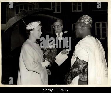 Jun. 08, 1959 - Queen meets Nigerians at Winchester.: H.M. The Queen chats with Usman Angulu Ahmed, a member of the Northern Nigerian House of Representatives and a district Councillor for the Province of Kabba, during her Royal visit to Winchester, Hampshire, today. In the centre is Mr. Alan Ludock, Chairman of the Hampshire County Council. Usman Angulu Ahmed is one of a group of Sixteen Northern Nigerian officials who are touring Britain as a study group. Stock Photo