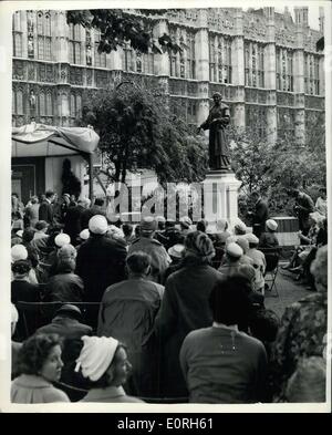 Jul. 13, 1959 - New Memorial to Dame Christabel Pankhurst Unveiled. A New Memorial to Dame Christabel Pankhurst which has been added to the statue of her mother Mrs. Emmeline Pankhurst, was unveiled this morning at the Victoria Gardens, near the House of Lords. Keystone Photo Shows: General view during the unveiling ceremony performed by Lord Kilmuir in Victoria Gardens this morning. Stock Photo