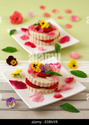 Tofu with strawberries and flowers. Recipe available. Stock Photo