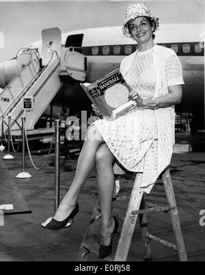 Actress Jane Russell reading at New York International Airport Stock Photo