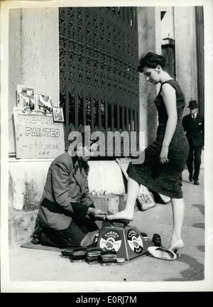 Oct. 10, 1959 - The Show black nail painter. Photo shows 48 year old Mr. Pat Downs, a shoe-black, of Roehampton, not only cleans shoes on his stand at Hyde park Corner but he also paints ladies toe nails for the moderate charge of d.a. foot. Stock Photo