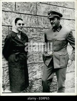 Apr. 04, 1960 - Wife of Greek premier attends shooting of film ''the Guns of Navarone''.: The filming of scenes on Rhodes Island of the film, ''the Guns of Navarone'', in which many famous stars, including Gregory Peck and David Niven, are taking part, was visited by Mrs. Amelia Karamanlis, wife of the Greek Prime Minister. Photo shows Mrs. Karamanlis pictured with one of the stars of the film David Niven, on Rhodes Island, where scenes are being shot. Stock Photo