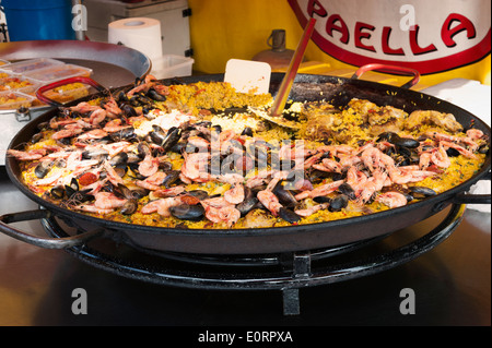 Large dish of Paella on a seafood market stall Stock Photo