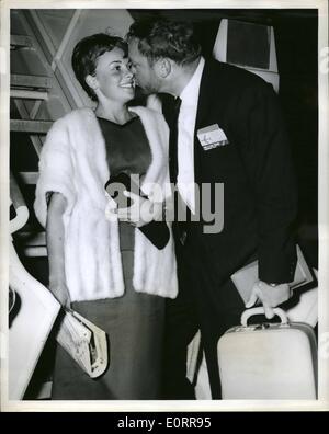 May 05, 1960 - N.Y. International Airport, -- Newly- Wed, Actor, Aldo Ray, Buzzes his bride the former Johanna Bennett, Daughter of a British General, Prior to the Couples departure aboard a TWA superjet to London Where they will Premiere Aldo's :Latest film ''The Day The Robbed the bank of England. Stock Photo