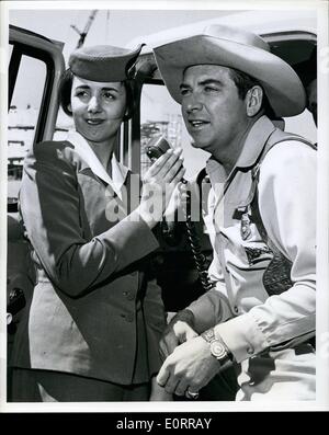 May 05, 1960 - N.Y. International Airport: John Bromfield TV's ''U.S.Marshal'' takes a call immediately on arrival via TWA's Superjet from St. Louis while TWA Hostess Nan El shall stands by Bromfield will make several TV & Personal appearances during his six day visit. Credit: Trans World Airlines Stock Photo