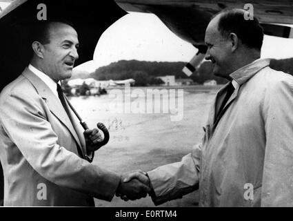 Politician C. Douglas Dillon greets colleague at airport Stock Photo