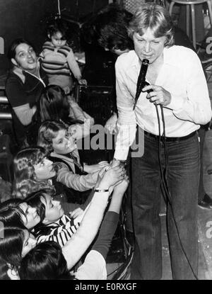 Singer Claude Francois sings in concert Stock Photo