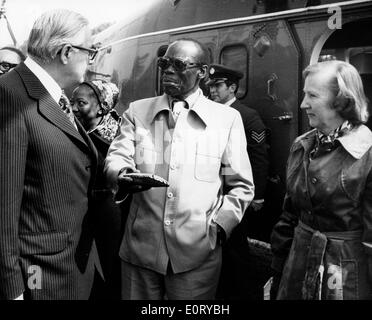 First president of Botswana SERETSE KHAMA, right, speaks to a man with his wife, RUTH WILLIAMS, right. Stock Photo