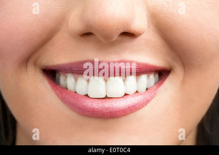 Macro close up of female smile showing healthy white teeth. Stock Photo