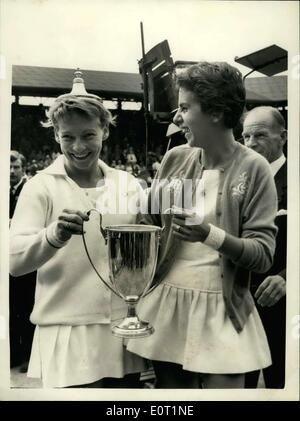 Jul. 02, 1960 - Women's Doubles final at Wimbledon. Fun with the cup. Photo shows Darlene Hard (USA) has a spot of fun by placing the lid of the Ladies Doubles Trophy - which she and Maria Bueno (Brazil) won by beating the south African Pair - Miss Reynolds and Miss Schuurman - at Wimbledon this afternoon. Stock Photo