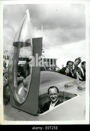 Jul. 07, 1960 - Campbell's ''Bluebird'' on show: Donald Campbell's new Bluebird car, with which he will make an attempt on the World' Land Speed Record on the Bonneville Salt Flats, Utah, in September, this year, was on display at the Good wood motor circuit today. The car, which is powered by a Proteus low speed trial runs later this week. The present record stands at 394 m.pph., set up by John Cobb. Photo shows Mr.Donald Campbell sits in the cooking of his new Bluebird at Good wood today. Stock Photo