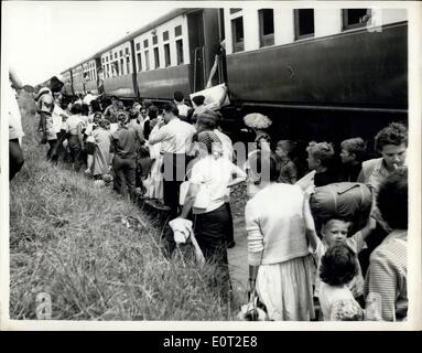 Jul. 19, 1960 - Refuges From Congo Arrive in Port Kingoma - The First Batch of 464 Belgian Refugeen from the Congo arrived at Port Kigoma on Lake Tanganyika. A Spicial Train was placed at the disposal of the refugees who comprised most belgians, but also included Greeks, Italians and Britisners. The train halted on a siding adjecent to Ukonga camp 10 miles from Dares Salaam where the refuges were being accomodated. Photo Shows:- The First of the refugees from the Congo Seen leaving the train at Port Kingoma. Stock Photo
