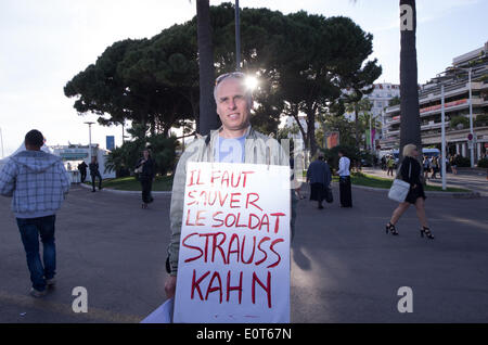Cannes, France. 18th May 2014. CANNES, FRANCE - MAY 18: man protest against Staruss kahn in cannes. during the 67th Annual Cannes Film Festival on May 14, 2014 in Cannes, France. The film festival will screen the last film of abel ferara inspired byt he struass kahn accused of raping of a waitress in a New York hotel. Credit:  JBphotoeditorial/Alamy Live News Stock Photo