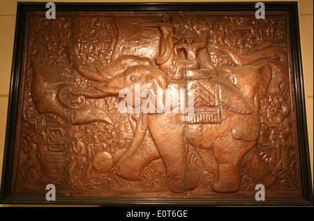 Ancient bronze relief in the History Museum in Hanoi. Stock Photo