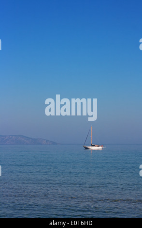 Single Yacht on a beautiful summers day in the Aegean sea Stock Photo