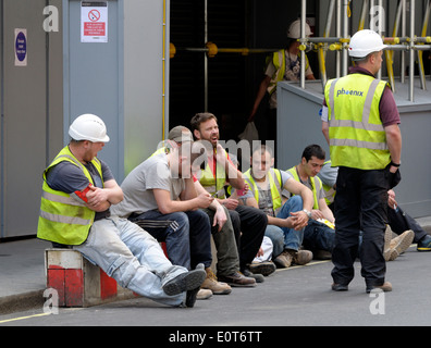 London, England, UK. Workmen taking a break in the street Stock Photo