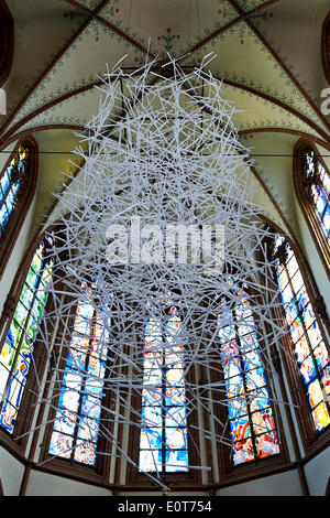 Hundreds of folded paper snippets from prayer books hang over the altar at St. Agnes Church in cologne, Germany, 19 May 2014. The installation by a paper artist Jo Pellenz measures four metres in diametre and weighs only 100 grams. Photo: MARIUS BECKER/DPA Stock Photo