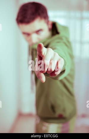 Portrait of serious man pointing at you. Stock Photo