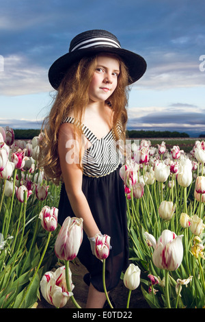 Young girl enjoying a tulip field Stock Photo