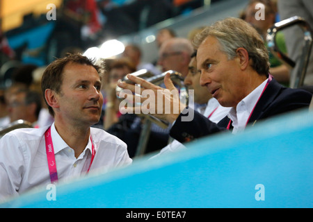 Britain's new Health Secretary Jeremy Hunt (L) and Former Prime Minister, Tony Blair (R) attend the swimming session competition held at the Aquatics Center during the London 2012 Paralympic Games in London, Britain, 07 September 2012. Stock Photo