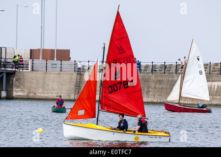 Dinghy racing with the West Cheshire Sailing Club on New Brighton marine lake. Stock Photo