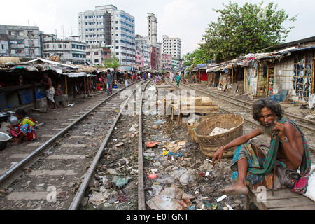 Bangladeshi people in shanty part of Dhaka along railroad living in extreme poverty. Stock Photo