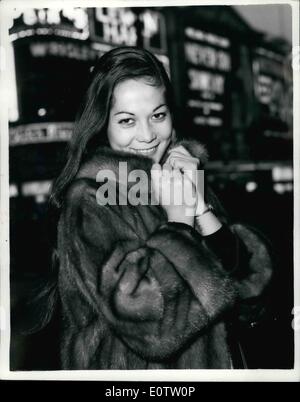 Sep. 12, 1960 - 9-12-60 Nancy Kwan goes sight-seeing in Piccadilly Circus. Nancy Kwan the star of the new film The World of Suzie Wong here for the premiere next Wednesday, went for a sightseeing tour of London this morning. Keystone Photo Shows: Nancy Kwan snuggles up into her coat in the cold breeze at Piccadilly Circus this morning. Stock Photo