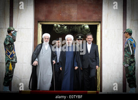 Tehran, Iran. 20th May, 2014. Iranian President Hassan Rouhani (C) smiles before leaving for China at Mehrabad Airport in Tehran, Iran, on May 20, 2014. Rouhani left Tehran for Shanghai on Tuesday morning to attend the Conference on Interaction and Confidence Building Measures in Asia (CICA) summit, to be held in Shanghai on May 20-21. © Ahmad Halabisaz/Xinhua/Alamy Live News Stock Photo