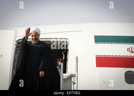 Tehran, Iran. 20th May, 2014. Iranian President Hassan Rouhani waves before leaving for China at Mehrabad Airport in Tehran, Iran, on May 20, 2014. Rouhani left Tehran for Shanghai on Tuesday morning to attend the Conference on Interaction and Confidence Building Measures in Asia (CICA) summit, to be held in Shanghai on May 20-21. © Ahmad Halabisaz/Xinhua/Alamy Live News Stock Photo