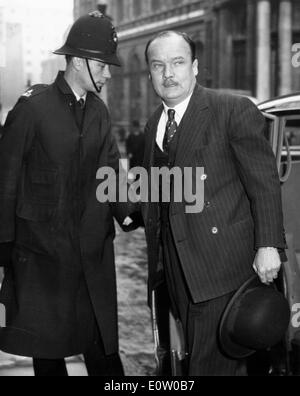 Politician John Hare on the street with police officer Stock Photo