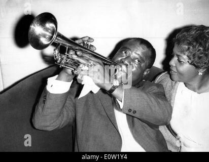Louis Armstrong playing the trumpet for his wife Lucille Stock Photo