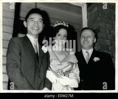 Dec. 12, 1960 - Yehudi Menuhin's Daughter Weds Chinese Pianist- The wedding took place this morning at Hampstead Register Office of twenty year old Zamira Menuhin daughter of world famous violinist Yehudi Menuhin to twenty six year old Mr. Fou Ts'ong who fled from Communist China two years ago to the West - to gain fame as a pianist. Keystone Photo Shows:- Yehudi Menuhin with the bride and bridegroom after the wedding this morning. JSS/KEYSTONE EM/725124 Stock Photo