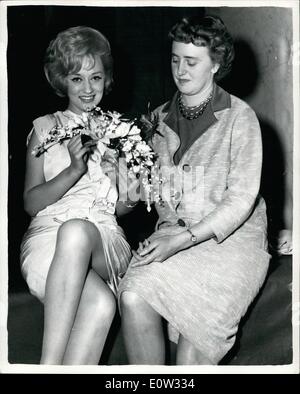 May 05, 1961 - Interflora National Bride's Bouquet Contest Final: The final of the Interflora National Bride's bouquet for a ft. 8in. tall bride - was held this morning in the River Room, Savoy Hotel, London. The winner was Miss An Ellis of Halifax, Yorks. Photo Shows Screen star Carol Lesley holds the prize winning bouquet - designed by Miss Ann Ellis - seen alongside - at the Savoy this morning. Stock Photo