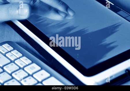 Touching digital tablet with business diagram Stock Photo