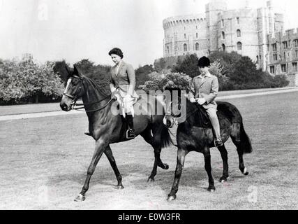 Queen Elizabeth II and Prince Charles horseback riding Stock Photo