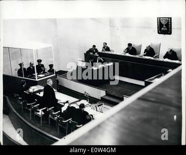 Apr. 04, 1961 - Trial of Adolf Eighmann.: The trial is being held in Jerusalem of Adolf Eigchmann, former Nazi S.S. Colonel on charges of mass murder of jews in wartime one entraction camps. Photo shows General view in the court in Jerusalem, showing Dr. Robert Servatius (defence), standing in left foreground, speaking when he questioned the legality of Israel to try Eigchmann. Eigchmann is seen on left flanked by guards in the bullet proof dock. Stock Photo