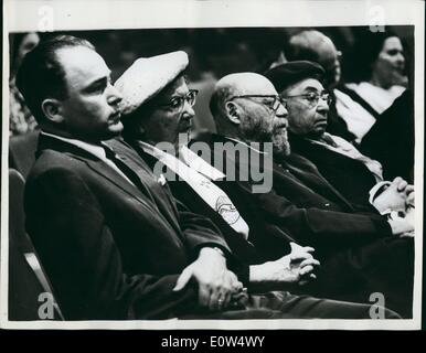 May 05, 1961 - The Eichmann Trial Continues in Jerusalem.: The Trial of Adolf Eichmann: Seen listening to the proceedings in Jerusalem are Mrs. Rachel Ben-Zwi (white hat) wife of the Israel President. On her left are Professor and Mrs. Dinur (he was former Minister of Education). It is unusual for high Government Officials to attend this trial Stock Photo