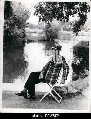 Jul. 07, 1961 - Bing Crosby Here To Make New ''Road'' Film Bing Crosby arrived in London to make a new film in the ''Road'' series. This time, it's ''Road To Hong-Kong'' with Bob Hope and Joan Collins. He visited the countryside near Egham, Surrey. Photo Shows:- Crosby relaxing by the Thames at Egham. Stock Photo