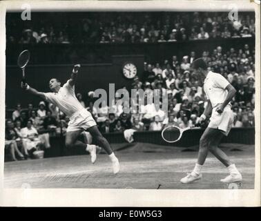 Jul. 07, 1961 - Tennis Championships at Wimbledon, Eight Day. OPS: C.R. McKinley (USA) partnered by R.D. Ralston in play against N. Fraser and R. Emerson (booth Australia). McKinley leaps to return a ball which flew behind his partner's head. Stock Photo