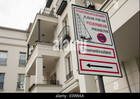Sign fire lane keep clear in front of multi-story apartment building in Germany Stock Photo
